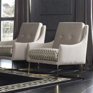 Atlas Accent Chair in modern grey and cream, showcasing bespoke luxury upholstery with sleek gold metal legs.