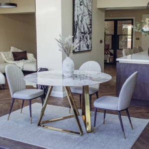 Elegant round marble table with luxurious gold legs, perfect for sophisticated interior design." This description is detailed, incorporates relevant keywords, and describes the item's appearance and potential use or appeal, which could help improve its visibility in search engine results.