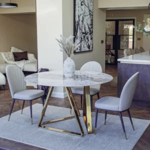 Elegant round marble table with luxurious gold legs, perfect for sophisticated interior design." This description is detailed, incorporates relevant keywords, and describes the item's appearance and potential use or appeal, which could help improve its visibility in search engine results.