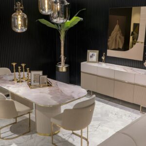 Elegant Cannes Sideboard in a Dining Room: Showcasing riveted beige doors and large cream drawers, this sideboard features a blush marble top, adding a sophisticated touch to the dining room decor.