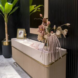 Elegant Cannes Sideboard in a Dining Room: Showcasing riveted beige doors and large cream drawers, this sideboard features a blush marble top, adding a sophisticated touch to the dining room decor.