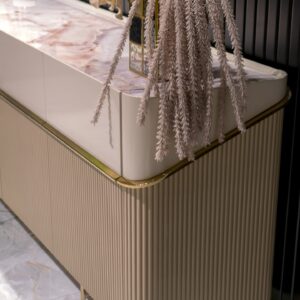 Elegant Cannes Sideboard in a Dining Room: Showcasing riveted beige doors and large cream drawers, this sideboard features a blush marble top, adding a sophisticated touch to the dining room decor.