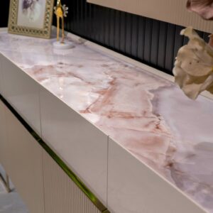 Elegant Cannes Sideboard in a Dining Room: Showcasing riveted beige doors and large cream drawers, this sideboard features a blush marble top, adding a sophisticated touch to the dining room decor.