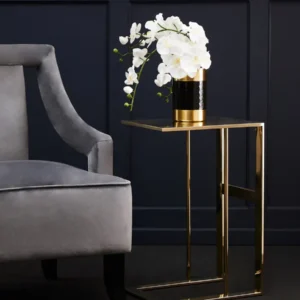 The Selene Gold C-Shaped Side Table adds an instant touch of luxury to any decor. Featuring a sleek, all-metal construction with a brilliant gold finish, this contemporary C-shaped table is both functional and stylish. Perfect for enhancing modern living rooms, bedrooms, or as an elegant accent next to your sofa. Features and Benefits: Elegant gold finish for a luxurious look C-shaped design for versatility and modern appeal Durable all-metal construction for lasting style Ideal for living rooms, bedrooms, or as a sofa-side accent