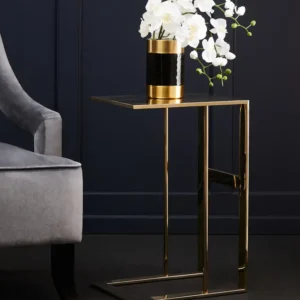 The Selene Gold C-Shaped Side Table adds an instant touch of luxury to any decor. Featuring a sleek, all-metal construction with a brilliant gold finish, this contemporary C-shaped table is both functional and stylish. Perfect for enhancing modern living rooms, bedrooms, or as an elegant accent next to your sofa. Features and Benefits: Elegant gold finish for a luxurious look C-shaped design for versatility and modern appeal Durable all-metal construction for lasting style Ideal for living rooms, bedrooms, or as a sofa-side accent