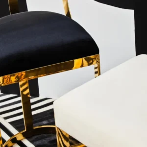 Celine Bar Stool with ivory velvet seat, featuring a gold or chrome X-shaped stainless steel frame and footrest for added support.