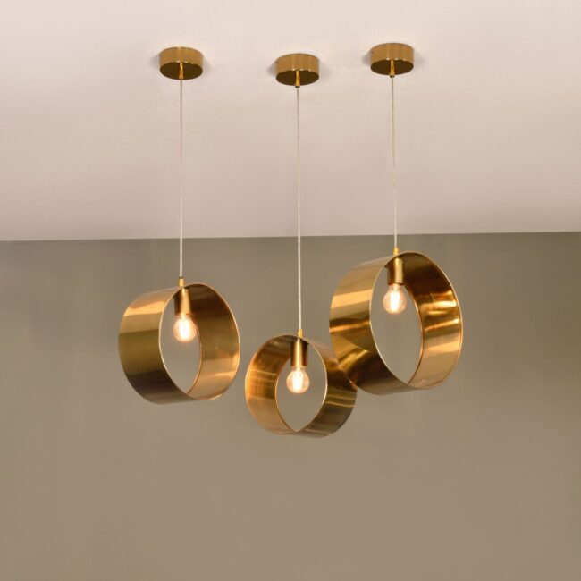 Striking and utterly unique, these pendants feature spherical designs in 3 varying sizes that leave the bulb exposed for a contemporary take on lighting. Ara three gold pendants are ideal for hanging in a hallway or for making a statement over a dining table.