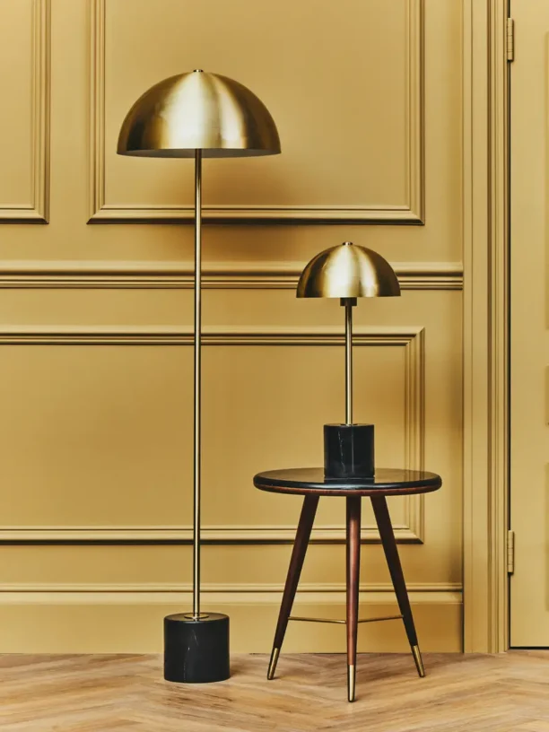 Introducing the Brushed Gold Dome Floor Lamp, a perfect fusion of contemporary design and timeless elegance. Featuring a dome-shaped brushed brass shade and a striking black marble base, this floor lamp is a captivating addition to any interior. Its sleek brass stem and shade offer a warm, sophisticated glow, while the luxurious black marble base provides modern grounding and stability.