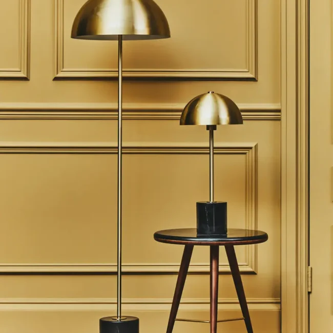 Introducing the Brushed Gold Dome Floor Lamp, a perfect fusion of contemporary design and timeless elegance. Featuring a dome-shaped brushed brass shade and a striking black marble base, this floor lamp is a captivating addition to any interior. Its sleek brass stem and shade offer a warm, sophisticated glow, while the luxurious black marble base provides modern grounding and stability.