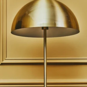 Introducing the Brushed Gold Dome Floor Lamp, a perfect fusion of contemporary design and timeless elegance. Featuring a dome-shaped brushed brass shade and a striking black marble base, this floor lamp is a captivating addition to any interior. Its sleek brass stem and shade offer a warm, sophisticated glow, while the luxurious black marble base provides modern grounding and stability.