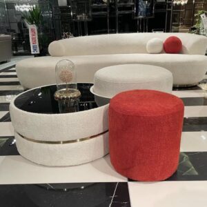 The Miami Curve Sofa features a curved silhouette upholstered in luxurious boucle fabric in your choice of colour and sitting on circular brass metal bases. The Miami Curve Sofa is a statement piece.