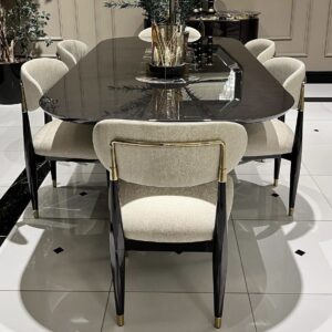 Perfect for hosting elegant dinner parties and lavish gatherings, the Athena table is an impressive 2.4 metres long seating 8-10 people. This bespoke-made table is crafted from a solid wooden core finished in a high shine latte or black gloss and detailed in gold or chrome metal.