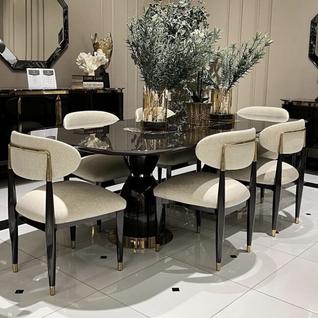 Perfect for hosting elegant dinner parties and lavish gatherings, the Athena table is an impressive 2.4 metres long seating 8-10 people. This bespoke-made table is crafted from a solid wooden core finished in a high shine latte or black gloss and detailed in gold or chrome metal.