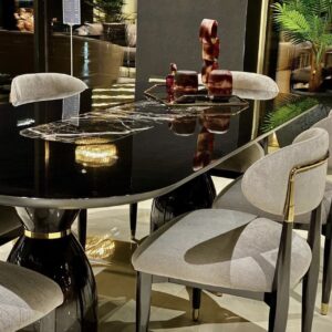 Perfect for hosting elegant dinner parties and lavish gatherings, the Athena table is an impressive 2.4 metres long seating 8-10 people. This bespoke-made table is crafted from a solid wooden core finished in a high shine latte or black gloss and detailed in gold or chrome metal.