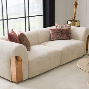 Transform your living space with the Aurelia Sofa – a stunning fusion of contemporary sophistication and lavish rose gold accents. Enveloped in sumptuous upholstery, this iconic piece beckons you to unwind in pure opulence. Select from a range of curated hues or tailor the sofa to match your desired color. Meticulously handcrafted with passion and unwavering commitment, our Aurelia Sofas adhere to the most stringent quality benchmarks, guaranteeing enduring resilience and indulgent comfort.