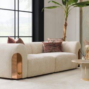 Transform your living space with the Aurelia Sofa – a stunning fusion of contemporary sophistication and lavish rose gold accents. Enveloped in sumptuous upholstery, this iconic piece beckons you to unwind in pure opulence. Select from a range of curated hues or tailor the sofa to match your desired color. Meticulously handcrafted with passion and unwavering commitment, our Aurelia Sofas adhere to the most stringent quality benchmarks, guaranteeing enduring resilience and indulgent comfort.