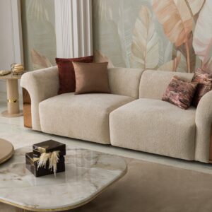 Transform your living space with the Aurelia Sofa – a stunning fusion of contemporary sophistication and lavish rose gold accents. Enveloped in sumptuous upholstery, this iconic piece beckons you to unwind in pure opulence. Select from a range of curated hues or tailor the sofa to match your desired color. Meticulously handcrafted with passion and unwavering commitment, our Aurelia Sofas adhere to the most stringent quality benchmarks, guaranteeing enduring resilience and indulgent comfort.