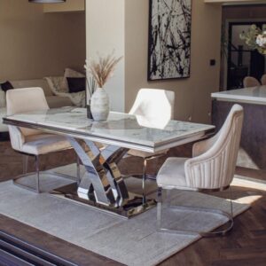 Elevate your dining room with the Roma Dining Table’s 1.8-meter top in luxurious marble, sintered stone, or glass. Features a polished stainless steel X-leg base for a modern touch