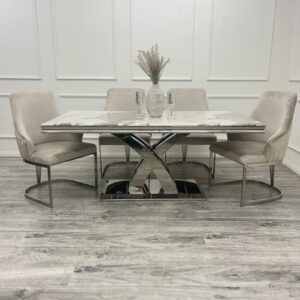 Elevate your dining space instantly with our new Roma Dining Table. This ultra-chic and stylish contemporary dining table redefines high-end living. Featuring a stunning 1.8-meter top available in luxurious marble or glass, as shown here in our warm and stylish Pandora Marble, it's paired with a polished stainless steel double x leg base. Our marble, Sintered Stone, and glass tops are not only incredibly hardwearing but also scratch-resistant. The sleek lines and smooth materials of the Roma Dining Table make it exceptionally easy to clean. With ample room for six dining chairs, it's the perfect centerpiece for your dining room.