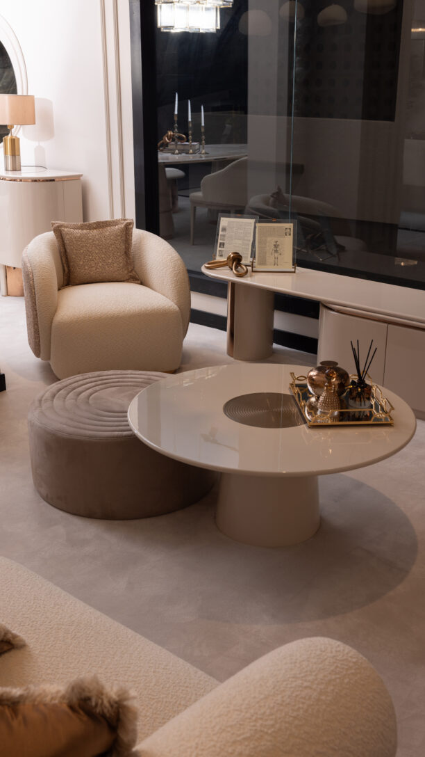 The Aurelia Coffee Table is a statement piece of modern sophistication, blending luxurious materials with timeless design. Part of the Aurelia Collection, it features a stunning cream gloss finish complemented by a rose gold reflective center that adds warmth and elegance to your living space. Its circular silhouette and sleek pedestal base make it a refined focal point, perfect for both contemporary and classic interiors. Features and Benefits: Elegant Design: Cream gloss finish with a rose gold reflective centerpiece. Modern Style: Circular silhouette with a sleek pedestal base. Part of the Aurelia Collection: Complements other luxurious pieces