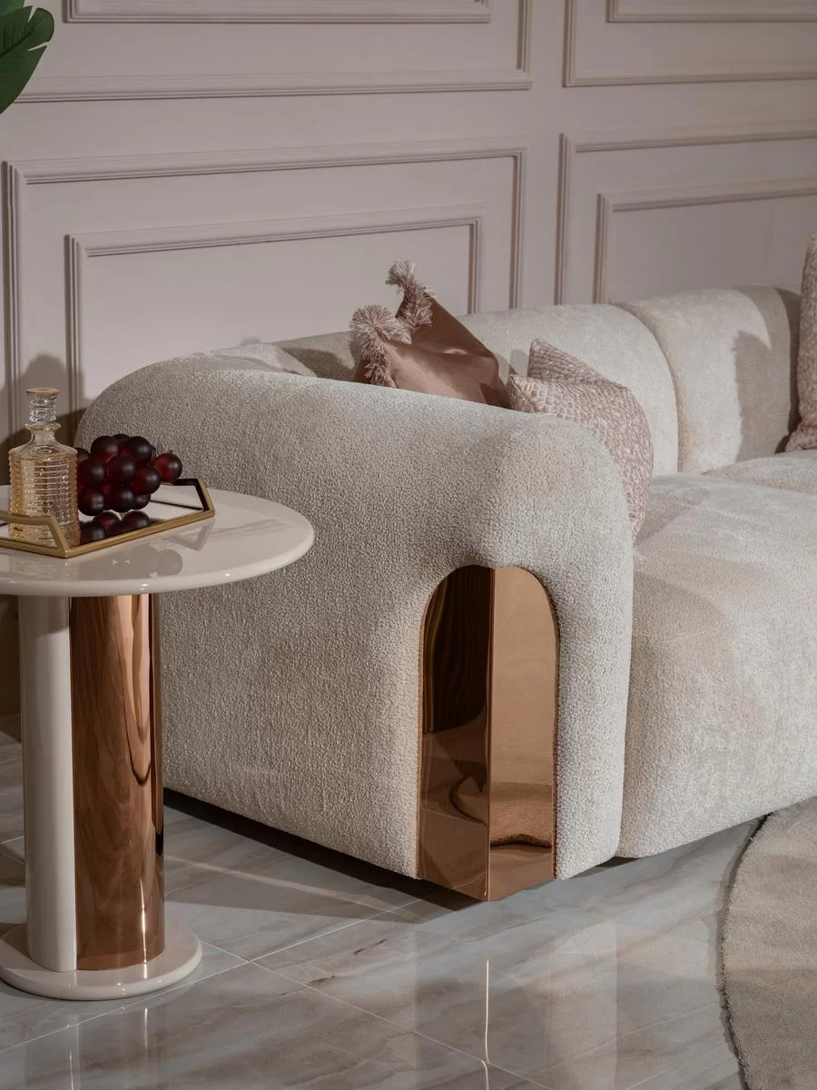 Stylish rose gold sofa with plush velvet upholstery and durable frame, adding luxury and warmth to modern living spaces. Perfect centerpiece for chic decor