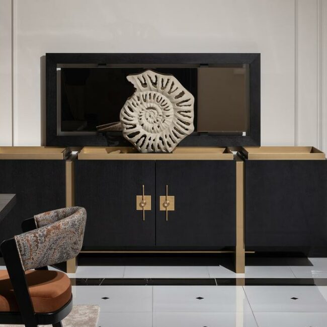 Elevate your living space with the Pierre Luxury Sideboard - a 2.4m bespoke masterpiece available in black wood and brushed gold detailing. This opulent piece features four spacious cupboards for practical storage, adorned with intricate metal handles for a touch of elegance.