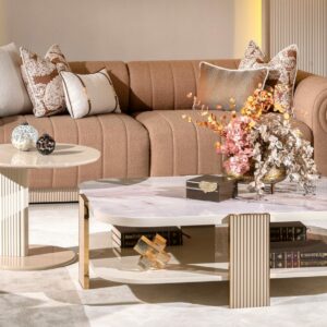 "Alt text: Rectangle-shaped Belize luxury coffee table featuring a blush marble effect and a lower shelf. Accented with gold or chrome detailing and intricate luxury embellishments for added sophistication."