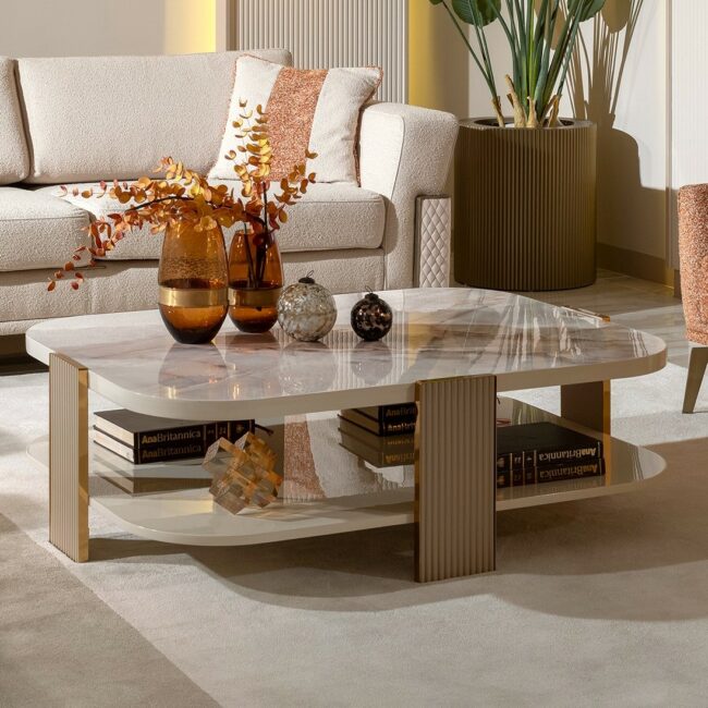 Elevate your living space with the Belize Luxury Marble Coffee Table, featuring a stunning cream and blush marble effect surface complemented by gold or chrome detailing. This exquisite piece exudes timeless elegance and is meticulously hand-crafted by our experts. A true statement of luxury, the Belize coffee table is perfect for adding sophistication to any interior. Features and Benefits: Cream and blush marble effect surface for a luxurious touch Available with gold or chrome detailing Hand-crafted by experts with meticulous attention to detail Dimensions: 120cm x 50cm Takes up to 6 weeks for manufacture