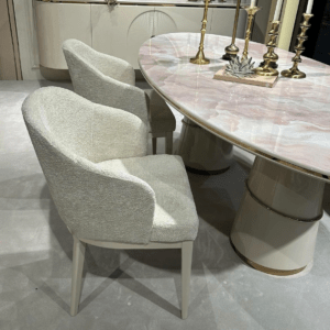 cream boucle dining chair and marble table