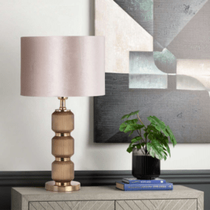 A stylish and sophisticated lighting fixture that adds a touch of elegance and texture to any room. The base of the lamp is crafted from high-quality glass in a warm brown hue, featuring a pleated design that creates a beautiful and unique visual appeal.