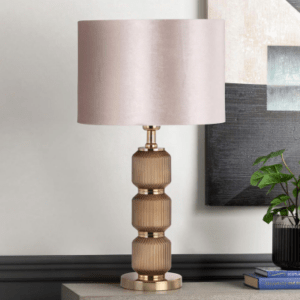 A stylish and sophisticated lighting fixture that adds a touch of elegance and texture to any room. The base of the lamp is crafted from high-quality glass in a warm brown hue, featuring a pleated design that creates a beautiful and unique visual appeal.