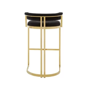 Elevate your bar area with the Piermont Bar Stool, boasting a luxurious black and gold color scheme. Inspired by the opulence of art deco design, its curved backrest and u-shaped base exude glamour. Wrapped in sumptuous velvet, the seat and backrest offer both style and comfort. Add a touch of sophistication to your space with the Piermont Bar Stool today