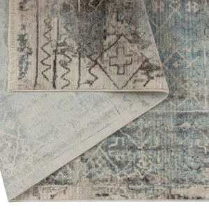 The Blake Rug brings celestial charm to your living space, marrying high-quality craftsmanship with luxurious comfort. Expertly crafted, its captivating design reminiscent of a Basquiat painting adds an artistic touch to your floor. With muted hues of blue, cream, and brown, it seamlessly complements contemporary settings while also enhancing traditional spaces like living rooms and bedrooms.