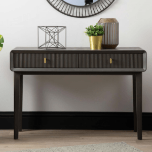 Introducing the Amelie Smoke Grey Elm 2 Drawer Console Table, a chic addition to your living space. Crafted from high-quality MDF with a sleek veneer finish in an elegant grey hue, this console table seamlessly combines practicality with contemporary style. With its two spacious drawers, it offers convenient storage solutions while adding a touch of sophistication to any room. Elevate your home decor with this versatile and refined furniture piece.