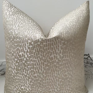 Introducing our Taupe Tempest Cushion, the epitome of luxury and sophistication. Crafted from sumptuous fabric with a radiant sheen, its opulent champagne hue accentuates the intricate texture that graces its surface, bringing depth to any room. Choose between the indulgence of a plush feather cushion insert or the sleek simplicity of the cover alone. Our cushions boast discreet invisible zip fastenings, ensuring a flawless appearance.