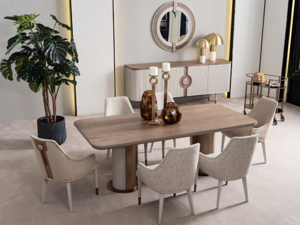 legant Serenity Dining Table with light oak wood top, cream upholstered chairs, and bronze accents, creating a sophisticated and modern dining space.