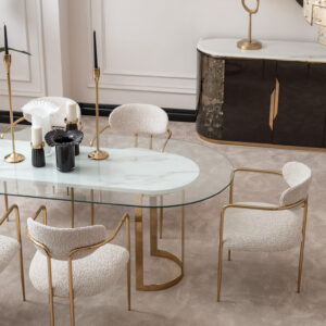 Elegant dining room featuring the Santorini Luxury Dining Set with a marble centerpiece and sleek glass top, surrounded by bespoke dining chairs upholstered in luxurious boucle fabric with gold metal frames, set against a stylish, modern interior