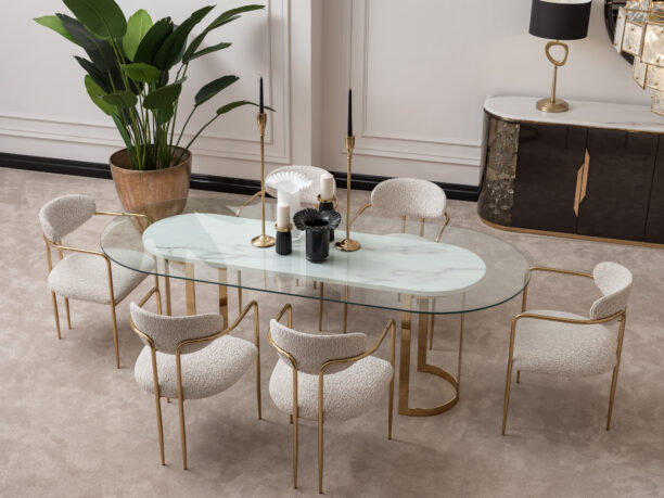 Elegant dining room featuring the Santorini Luxury Dining Set with a marble centerpiece and sleek glass top, surrounded by bespoke dining chairs upholstered in luxurious boucle fabric with gold metal frames, set against a stylish, modern interior