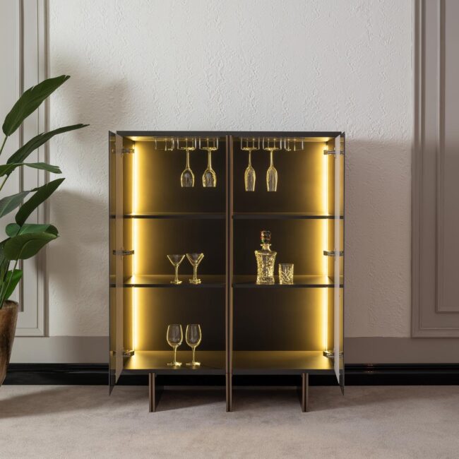 Discover the Aurora Bar Cabinet—a made-to-order luxury wooden cabinet featuring a glass front and integrated LED lighting. Perfect for showcasing your finest glassware in style.