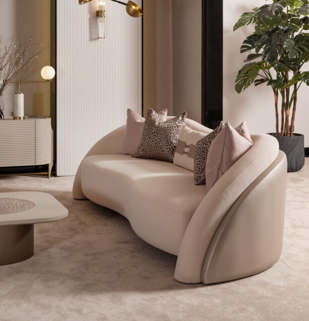 Bespoke Liora Sofa with a curved silhouette, plush upholstery, and a leather-wrapped back, available in various colors to match any home décor, showcasing luxury and modern design.