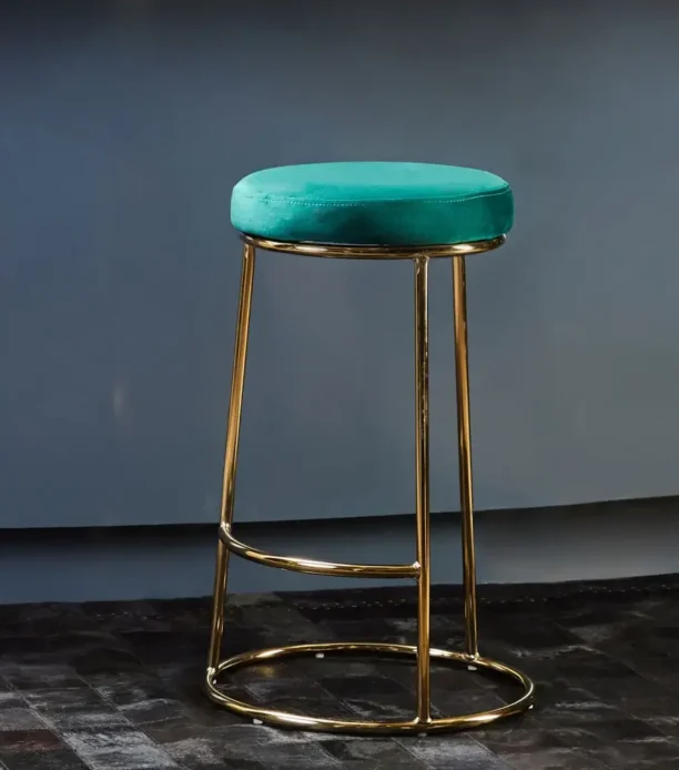 Luxe Teal Green Bar Stool with plush velvet upholstery and a sleek gold-finished frame, featuring a footrest for added comfort. Ideal for counter-height seating.