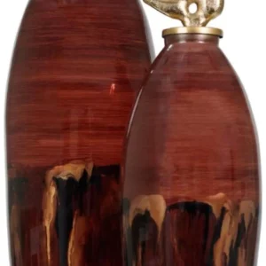 Introducing the Opal Luxe Jar Collection, the perfect blend of sophistication and timeless design. Crafted for those who appreciate refined decor, these jars feature a striking ombre burgundy finish that exudes warmth and luxury. Topped with a gleaming gold lid, they are sure to elevate any room with their elegant presence. Available in both small and large sizes, these jars make an unforgettable statement whether displayed individually or as a pair.