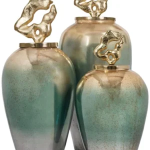 Step into a world of refined elegance with the Solara Luxe Jar Collection, a trio of stunning jars crafted for those who appreciate timeless beauty. Featuring a captivating three-color ombre effect in opulent shades of gold, green, and white, these jars are true works of art. Each jar is topped with a gilded, sculptural lid, adding a touch of grandeur to any space. Perfect for console or shelf styling, the Solara Luxe jars embody luxurious sophistication in every detail. Please note that due to the hand-painted finish, slight variations in color and finish enhance the unique charm of each piece. Features and Benefits: Three-color ombre design in gold, green, and white Sculptural gold lid for a statement look Available in a trio of sizes for versatile styling Hand-painted finish for unique variation Ideal for adding luxury to any space