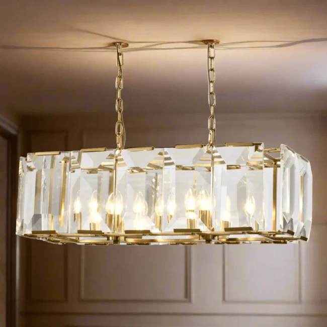 The Belgravia Crystal Chandelier is a striking statement piece, combining modern glamour with a luxurious blend of crystal and brass. With its rectangular design, this chandelier adds a bold and dramatic touch to any room. Part of our Eton Collection, it’s perfect for those seeking a sophisticated lighting solution.