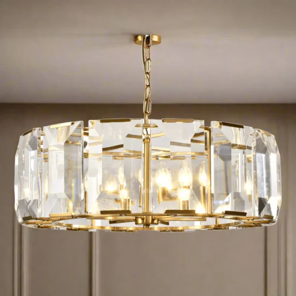 The Belgravia Crystal Chandelier is a striking statement piece, combining modern glamour with a luxurious blend of crystal and brass. With its circular design, this chandelier adds a bold and dramatic touch to any room. Part of our Eton Collection, it’s perfect for those seeking a sophisticated lighting solution. FEATURES: Stunning crystal and brass design