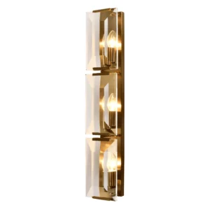 The Belgravia Wall Light exudes boldness and glamour, making it a standout piece for any room. Crafted with faceted crystal prisms and brass, it beautifully reflects and refracts light, reminiscent of emerald-cut diamonds. This luxurious crystal and brass wall light is the perfect addition to any space, combining timeless elegance with modern sophistication.