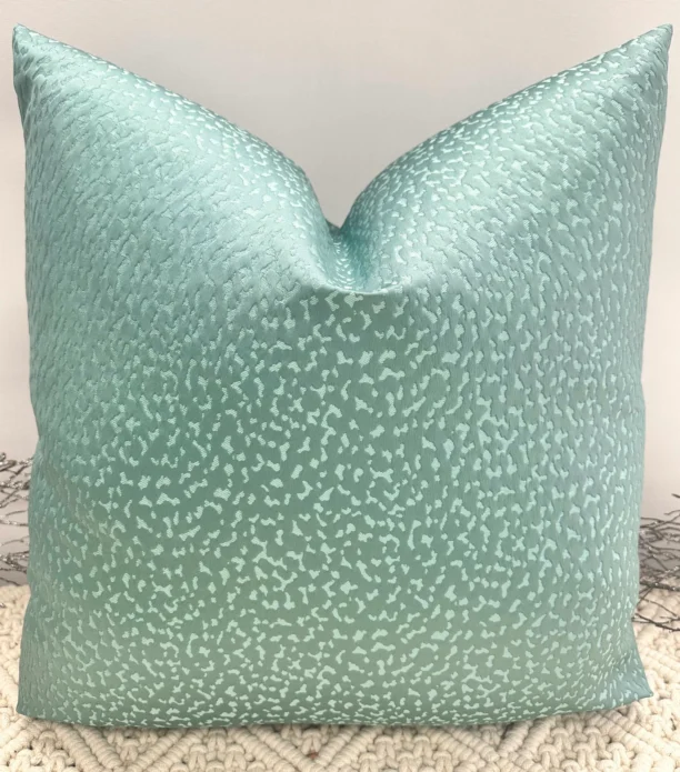 The Vivara Teal Luxury Cushion is designed to bring a bold pop of color and texture to your space. With its stunning teal hue and customizable size options, this cushion can be tailored with either 100% luxury duck feather or polyester inserts for your desired comfort. The invisible zip fastening ensures a sleek, seamless finish, making the Vivara cushion both elegant and practical. If you’re uncertain about the color, feel free to request fabric samples, or consult our in-house interior designers for personalized advice on fabric selection and cushion styling. Features and Benefits: Customizable in a range of sizes Choice of luxury duck feather or polyester inserts Invisible zip for a seamless finish Striking teal hue for a vibrant decor accent Personalized design assistance available from expert designers