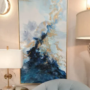 Elevate your interior with the Azure Waves Wall Art by Mindy Brownes, a stunning contemporary piece featuring waves of monochromatic blues enhanced with bold pops of gold.