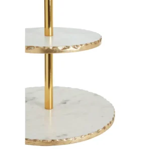 The Golden Edge Marble Cake Stand features two luxurious marble shelves, each adorned with elegant gold foil accents along the edges, providing a striking contrast to the natural marble surface. These round tiers are supported by a sturdy gold finish metallic rod, offering a secure grip for easy handling. Perfect for serving cakes and desserts, this cake stand adds a sophisticated warm metallic accent to your dinner table, making it an ideal centerpiece for special occasions. Features and Benefits: Two marble shelves with elegant gold foil accents for a luxurious look Gold finish metallic rod for sturdy support and easy carrying Perfect for displaying cakes, desserts, or appetizers Adds a warm, metallic accent to dining tables Easy to clean – wipe with a soft clean cloth Care and Use: Wipe with a soft clean cloth Do not use abrasive cleaners Serve in style with the Golden Edge Marble Cake Stand. Featuring two marble tiers with gold foil accents and a sturdy gold rod, this elegant cake stand is perfect for special occasions.