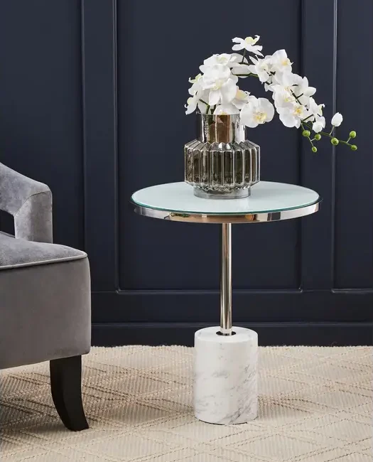 Elevate your space with the Verona White Marble & Chrome End Table. Featuring a round marble top and chrome pedestal base for a modern luxe look.